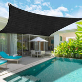 Black 3x6m shade net secured with eyelets overhead to provide shade coverage over a pool