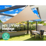 Sand 5x5x5m equilateral triangle waterproof shade sail installed with a slope providing rain and sun protection over a corner patio.