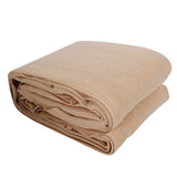 Neatly folded 6m x 6m square beige shade sail fabric showing compact storage layout.