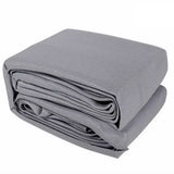 Neatly folded 6x8m grey shade sail fabric showing compact storage layout.