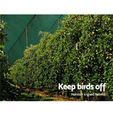 3.66m wide 90 percent green shade cloth installed along a boundary fence line for yard privacy screening and windbreak defense and to protect fruit trees from birds and flying foxes