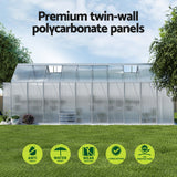 Greenhouse with premium twin-wall polycarbonate panels and feature icons in an Australian backyard