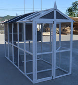 Large outdoor chicken coop assembled in a backyard setting showing the double door access