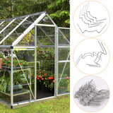 Greenhouse W-clamps successfully holding a twin-wall polycarbonate panel firmly inside an outdoor garden greenhouse frame.