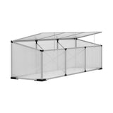Close-up of the three fully opened roof ventilation panels on the polycarbonate greenhouse showing the plastic holders.