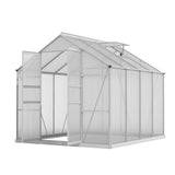 Detail shot of an open adjustable roof vent on an outdoor greenhouse frame for climate and humidity control.