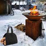 An outdoor camping setup in snowy backyard with the rugged black canvas firewood basket for sale loaded with twigs and branches.