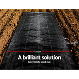 Black 0.915m x 50m weed mat laid out on garden soil for chemical-free weed control in garden beds