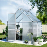 Walk-in polycarbonate garden greenhouse with aluminium frame setup in a small Australian backyard