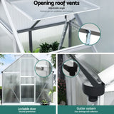 Open adjustable roof vent and lockable entry door on small polycarbonate greenhouse