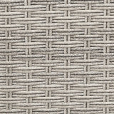 Close-up of grey PE wicker weave on an outdoor recliner chair