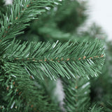 Close-up of dense PVC branch tips on an 8ft Jingle Jollys fake Christmas tree.