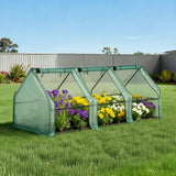 Low-profile mini garden greenhouse with steel frame set up over garden bed