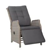 Grey wicker outdoor recliner chair with grey cushions and extended footrest
