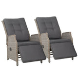 Set of two grey wicker outdoor recliner chairs with footrests extended