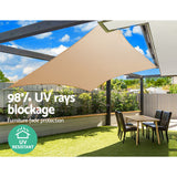 Large sand square shade sail installed poolside over sun lounges in an Australian backyard.