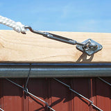 Shade sail turnbuckle connected to a metal pad eye mounted on a timber beam